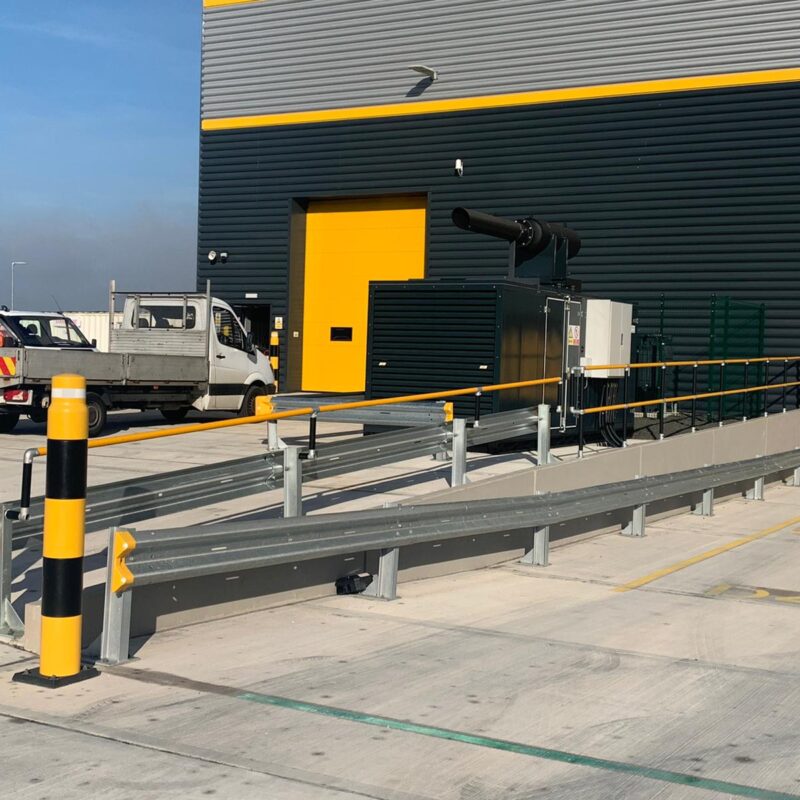 Armco 760HR Safety Barrier on loading bay ramp incline with ImpactSAFE bollards at DHL Manton Wood