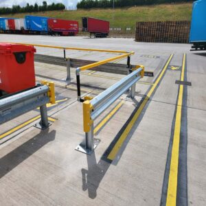 Armco 760HR Safety Barrier in logistics yard with lorry containers and bin enclosure