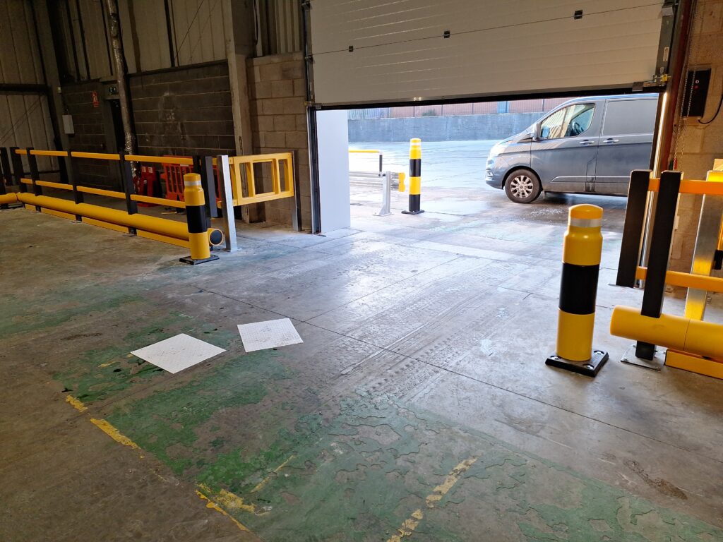 Heavy Duty Bollards in a Loading Bay with Single Bumper Pedestrian Barriers PAS 13 Tested.